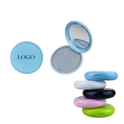 Denture case with a mirror